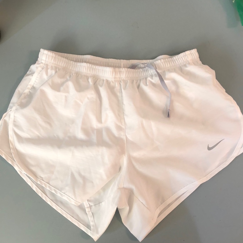White Nike running shorts